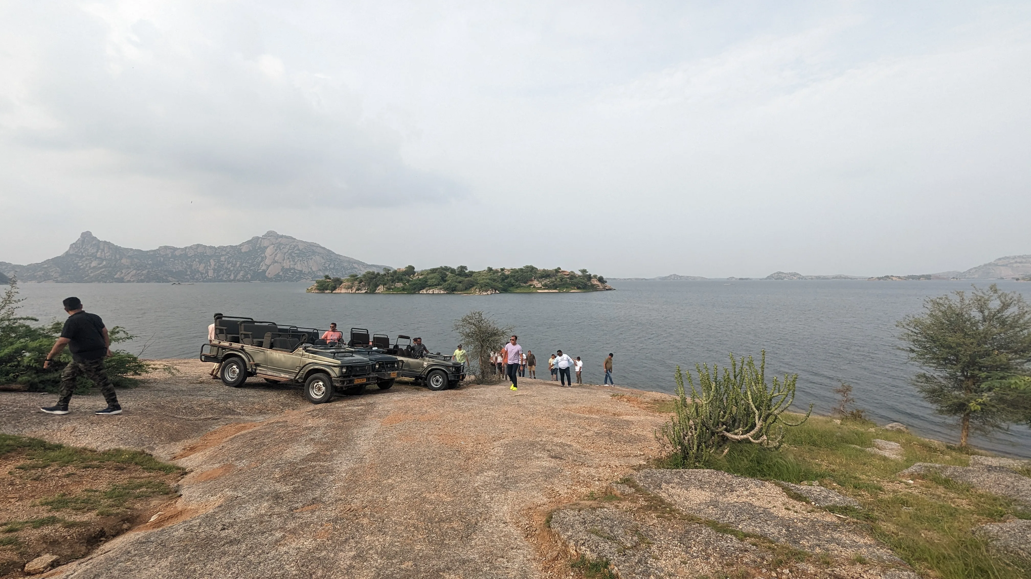 Jeeps parked on the rock above the lake